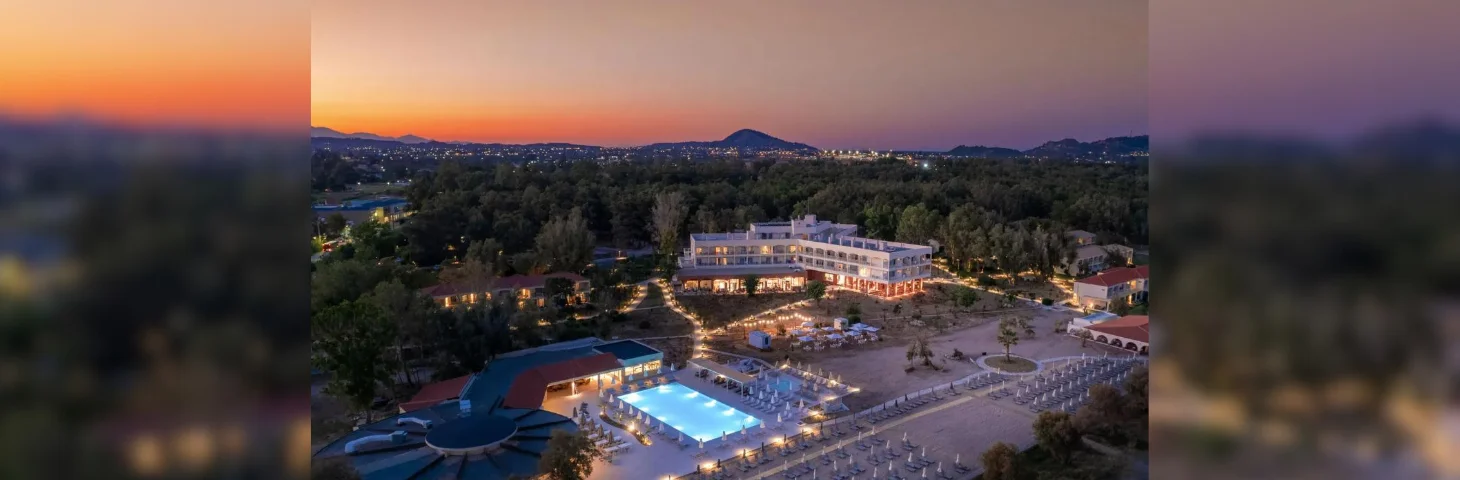 An aerial shot of Domes Resorts' five-star Hotel Zakynthos property at sunset.