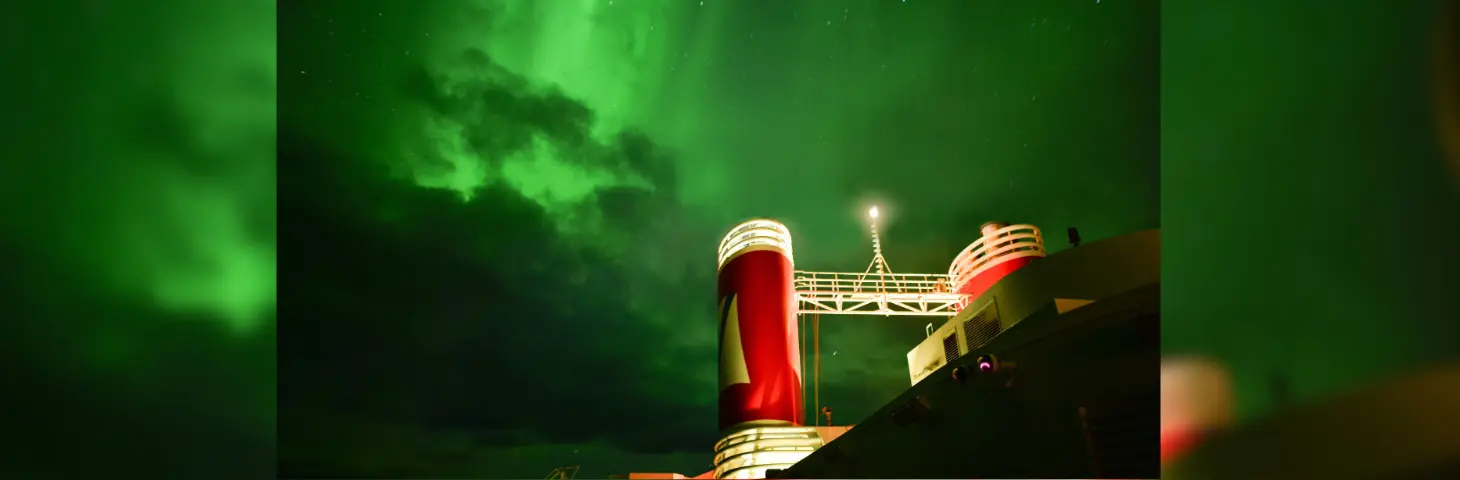 Image of a Fred. Olsen ship under the Northern Lights