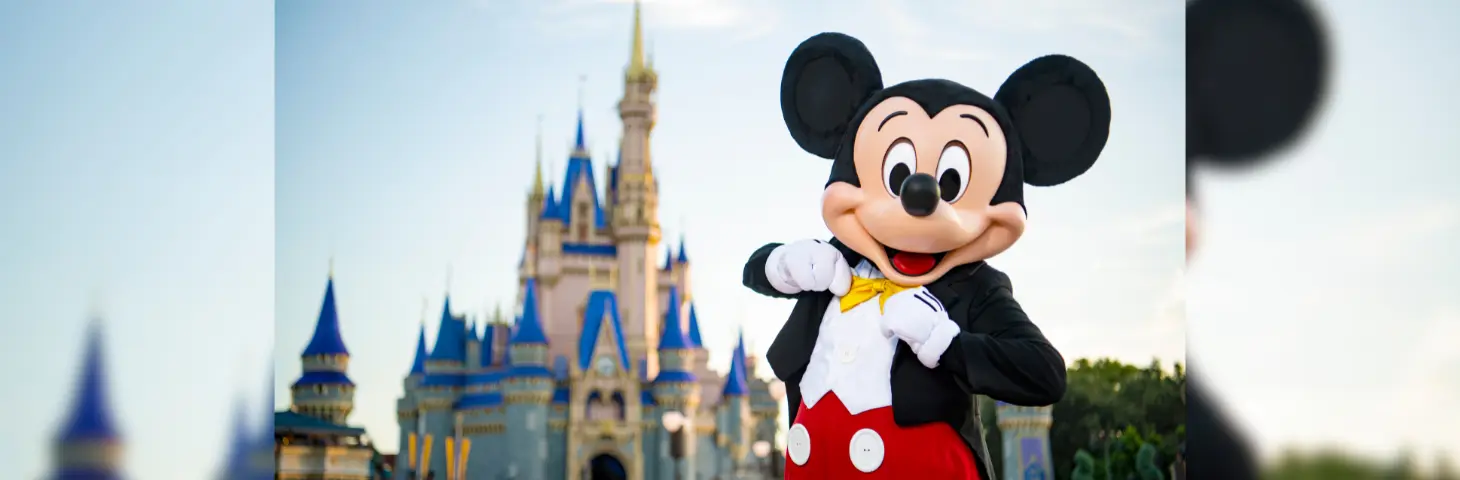 Image of Mickey Mouse in front of the Disney Castle. 