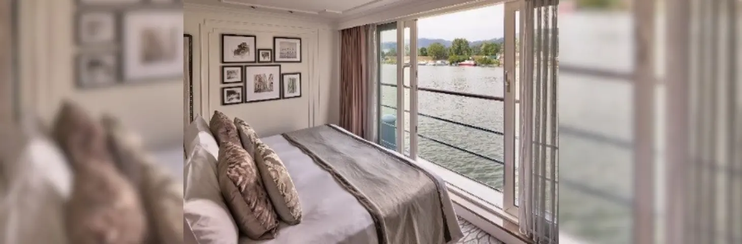 Image of the inside of a Riverside Luxury vessel bedroom aboard 