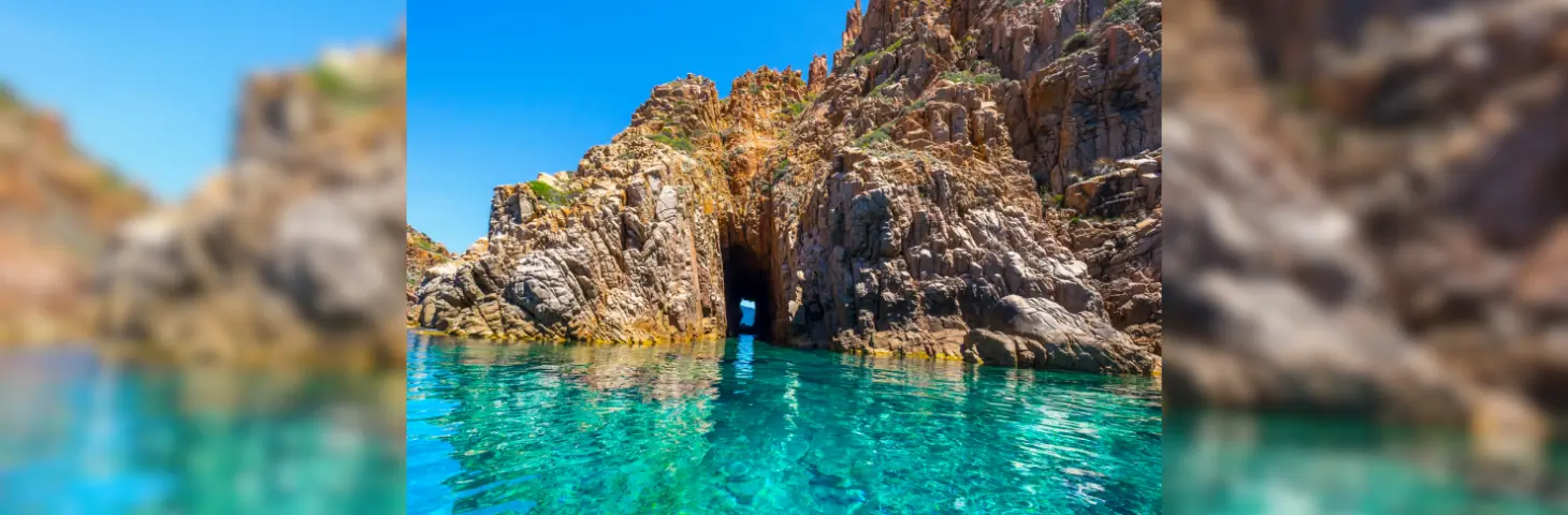 Image of a rocky coast in the clear blue waters 