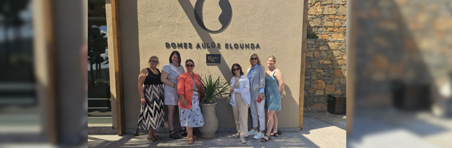 Image of six agents standing by the Domes Aulus Elounda property